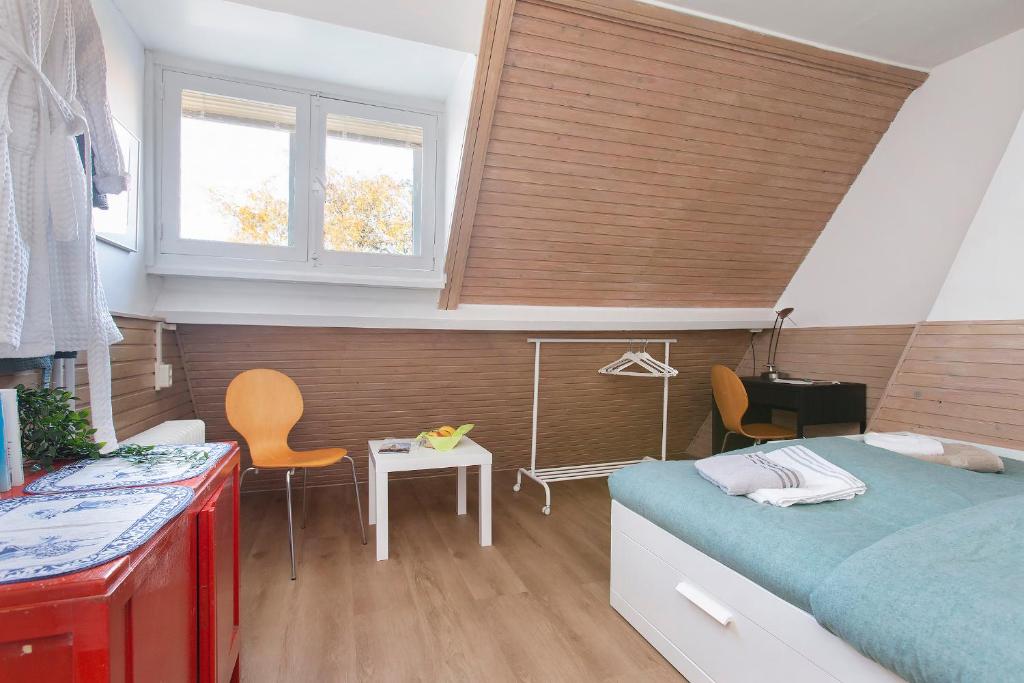 Postel nebo postele na pokoji v ubytování Residentie Blijdorp