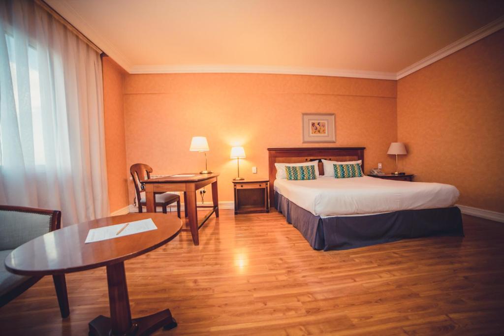Letto o letti in una camera di Lucania Palazzo Hotel