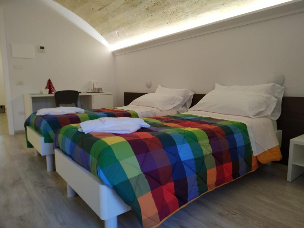 Postel nebo postele na pokoji v ubytování In & Out Matera