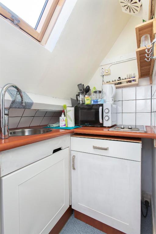 Kuchyň nebo kuchyňský kout v ubytování Residentie Blijdorp