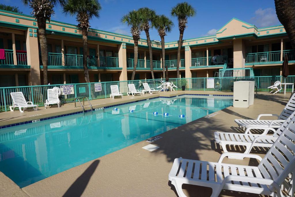 a swimming pool in front of a hotel at Royal Palace Inn and Suites Myrtle Beach Ocean Blvd in Myrtle Beach