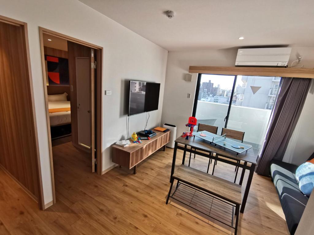 TV a/nebo společenská místnost v ubytování Popway Residence Tennoji