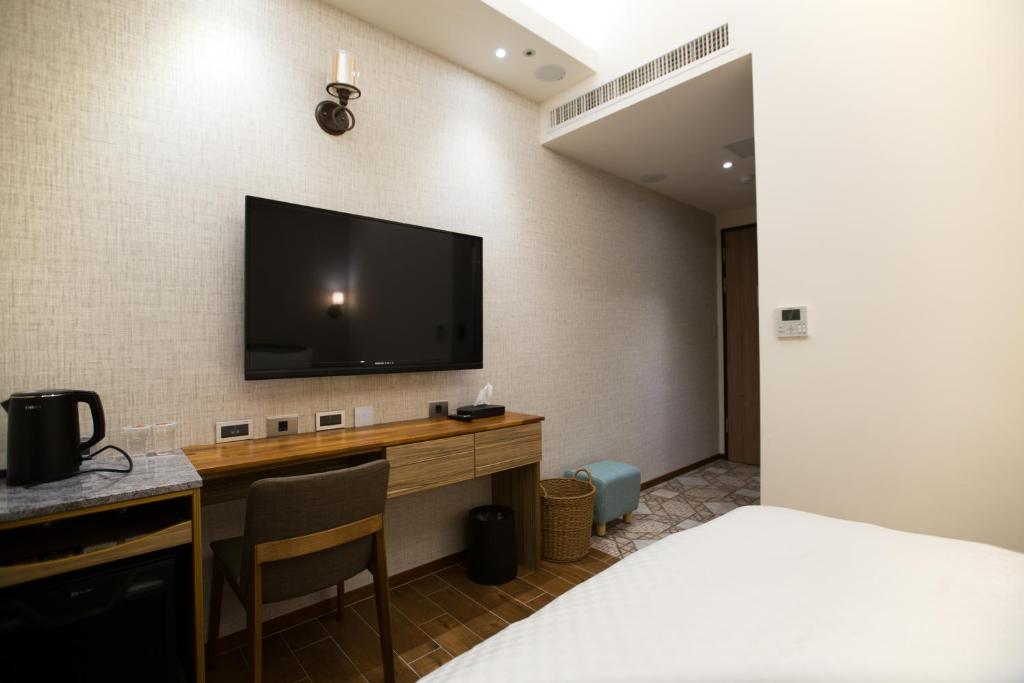 TV a/nebo společenská místnost v ubytování 原鄉商旅 Yuan Hsiang Hotel