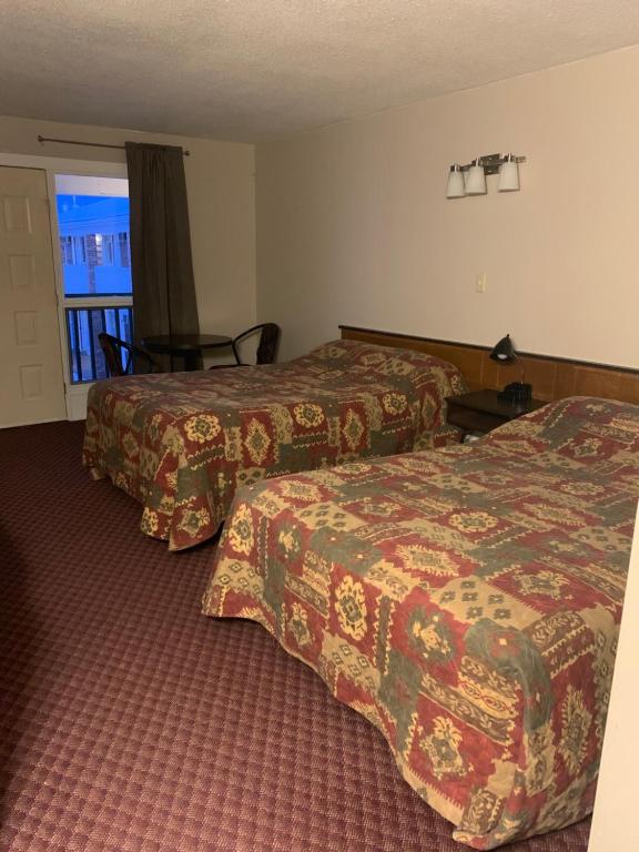 Postel nebo postele na pokoji v ubytování Airways Motel