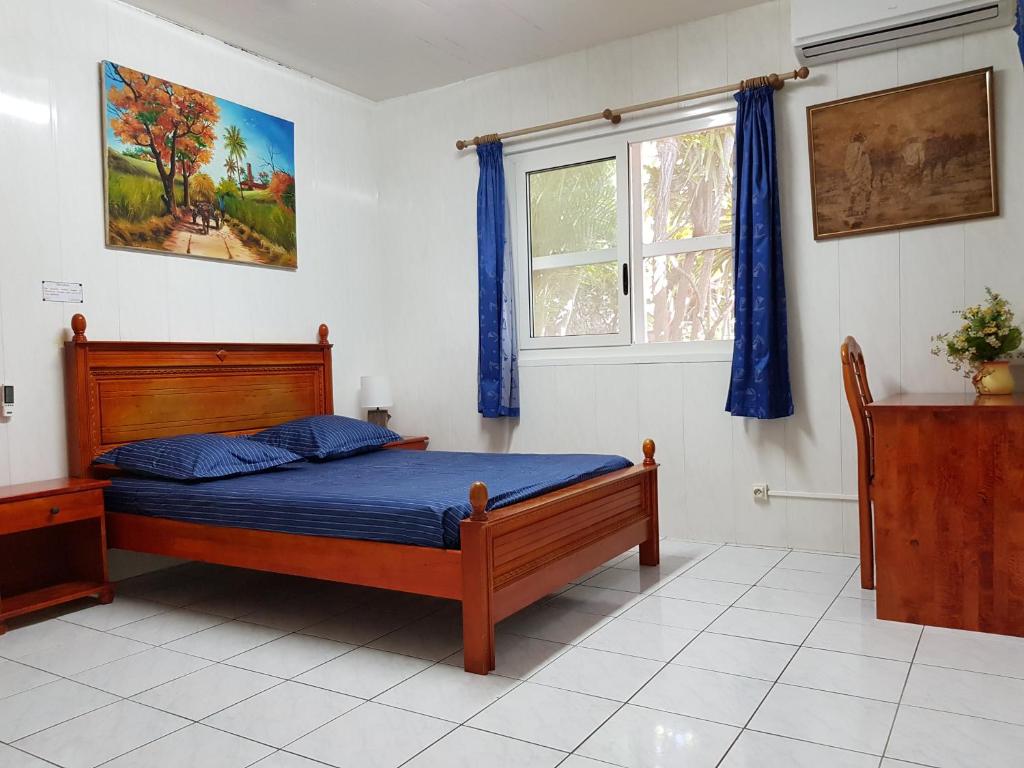 Postel nebo postele na pokoji v ubytování Hotel CHEZ PAPA DAYA