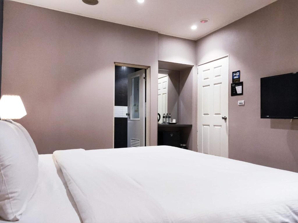 Postel nebo postele na pokoji v ubytování Roppongi Motel