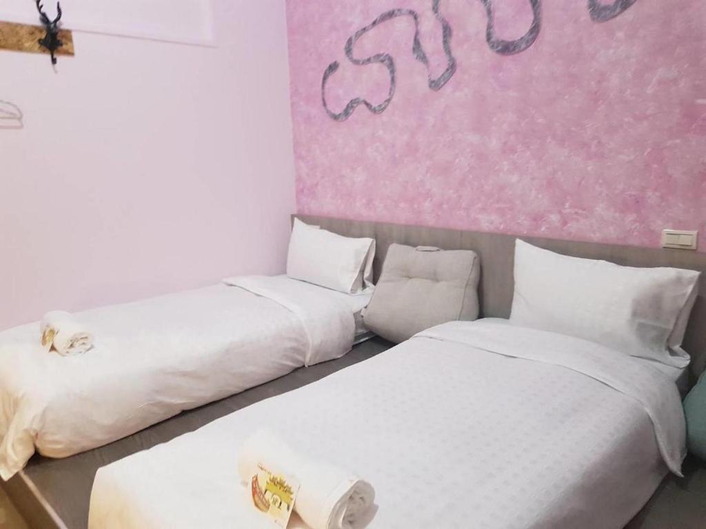 Postel nebo postele na pokoji v ubytování 東立方旅宿-East Cube B&B