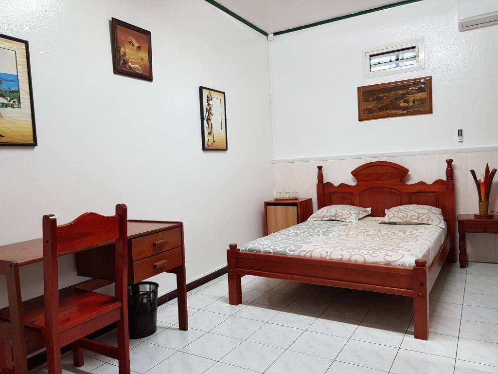 Postel nebo postele na pokoji v ubytování Hotel CHEZ PAPA DAYA