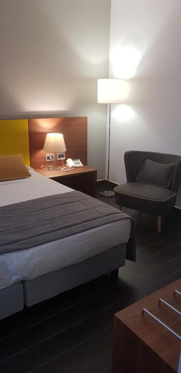 Postel nebo postele na pokoji v ubytování Hotel Sandalia