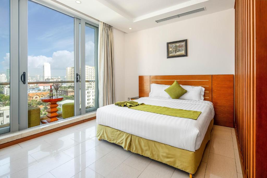 Postel nebo postele na pokoji v ubytování Richico Apartments And Hotel