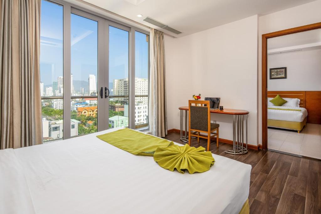 Postel nebo postele na pokoji v ubytování Richico Apartments And Hotel