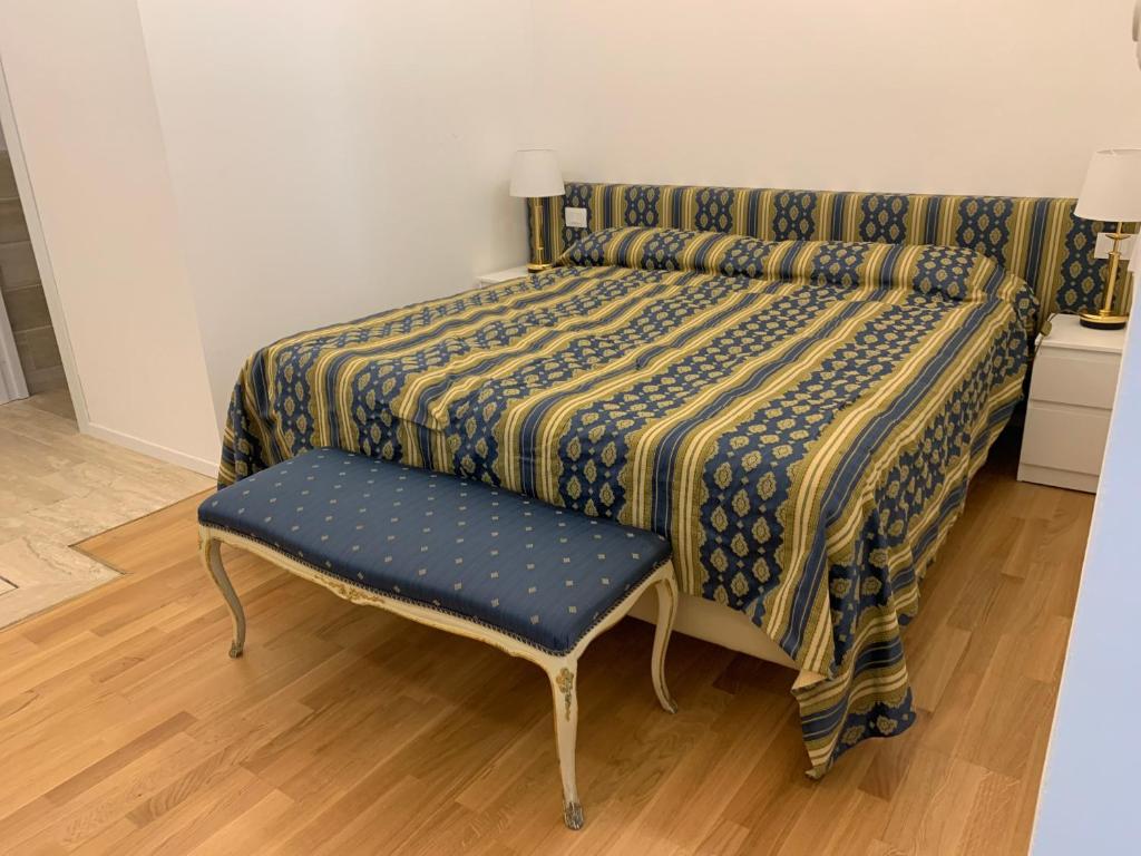 A bed or beds in a room at Nerello Suites and Rooms