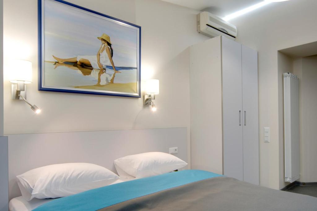 Postel nebo postele na pokoji v ubytování Arena Summit Apart Hotel