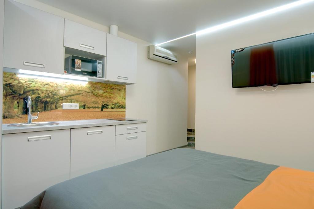 Kuchyň nebo kuchyňský kout v ubytování Arena Summit Apart Hotel