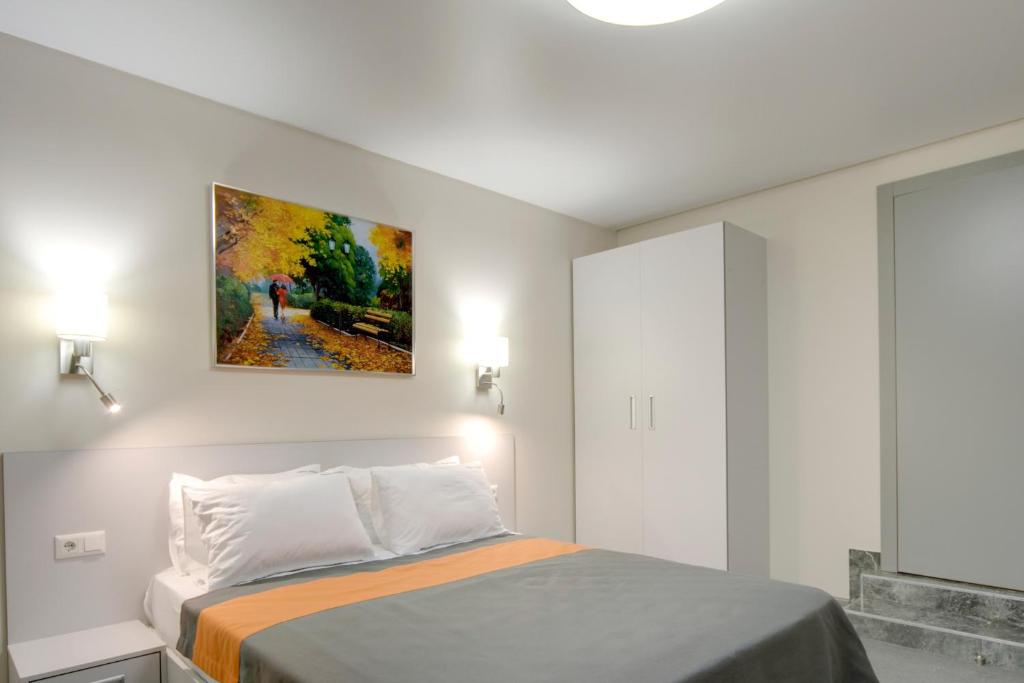 Postel nebo postele na pokoji v ubytování Arena Summit Apart Hotel