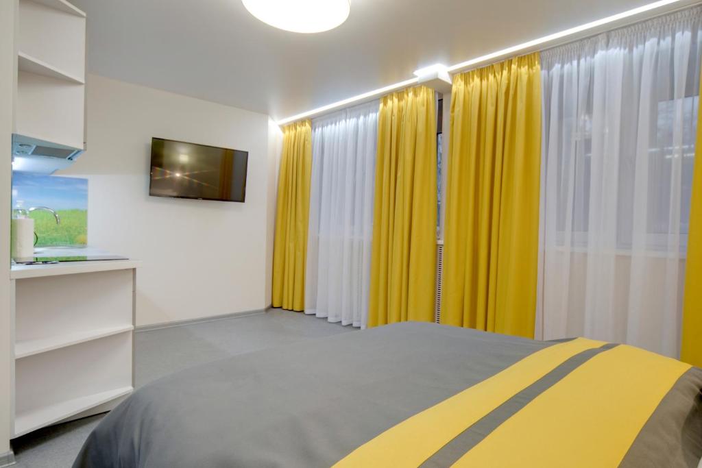 Postel nebo postele na pokoji v ubytování Arena Summit Apart Hotel
