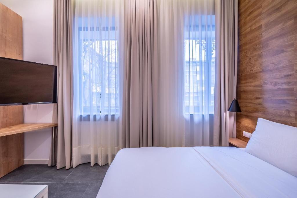 Postel nebo postele na pokoji v ubytování 5 STAR APART HOTEL