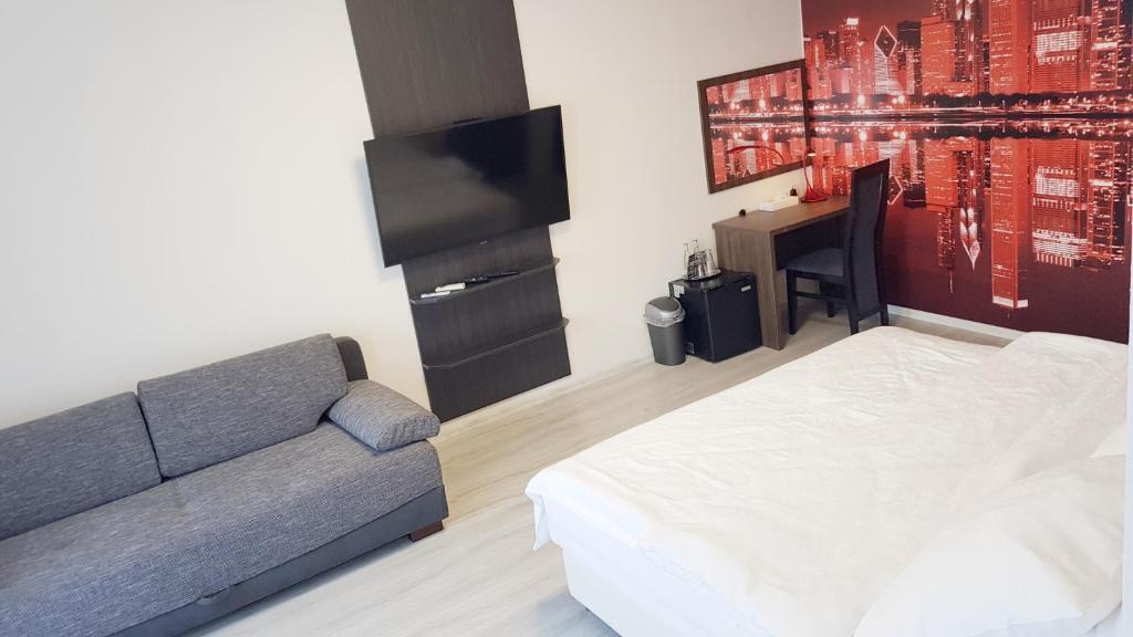Postel nebo postele na pokoji v ubytování Restaurace a hotel Amerika