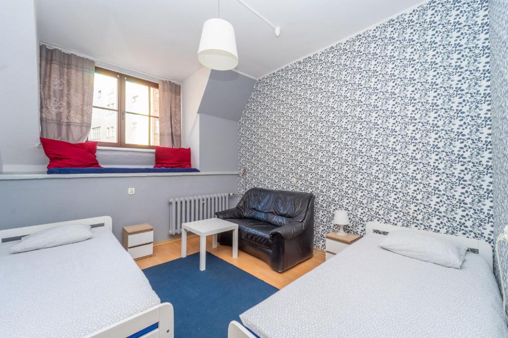 Postel nebo postele na pokoji v ubytování Hostel Universus
