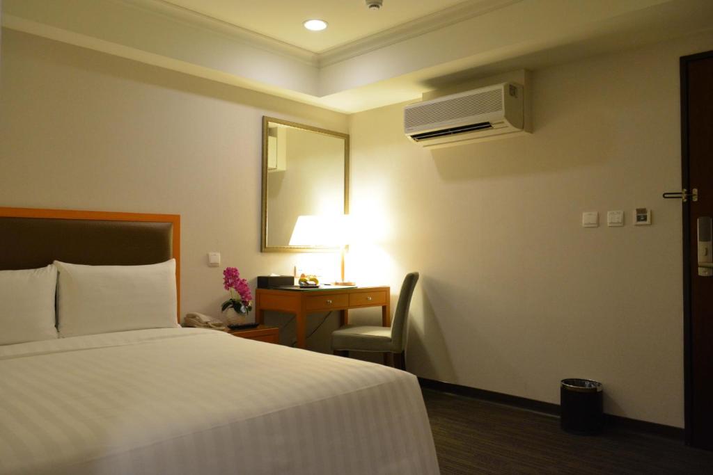 Postel nebo postele na pokoji v ubytování Fuward Hotel Tainan