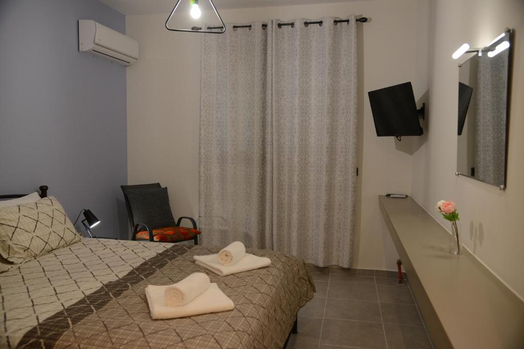 Postel nebo postele na pokoji v ubytování Katsaros - Elegant Home in Nafplio
