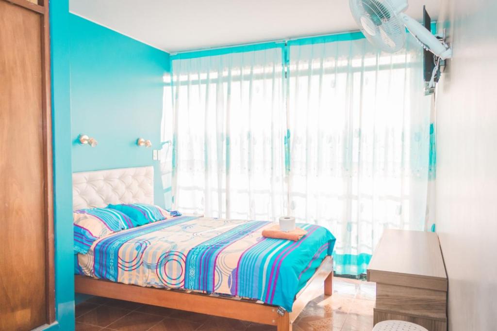 Postel nebo postele na pokoji v ubytování HOSPEDAJE LOS PAREDONES