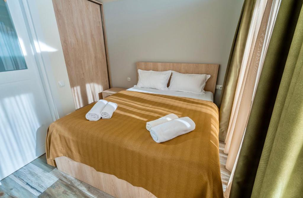 Postel nebo postele na pokoji v ubytování GVC 3-room 2-level apt New Gudauri