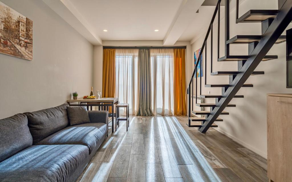 Posezení v ubytování GVC 3-room 2-level apt New Gudauri