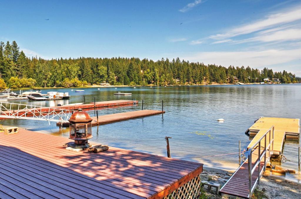 a dock on a lake with a marina at Newport Cabin with Lakefront Private Porch and Grill! in Newport