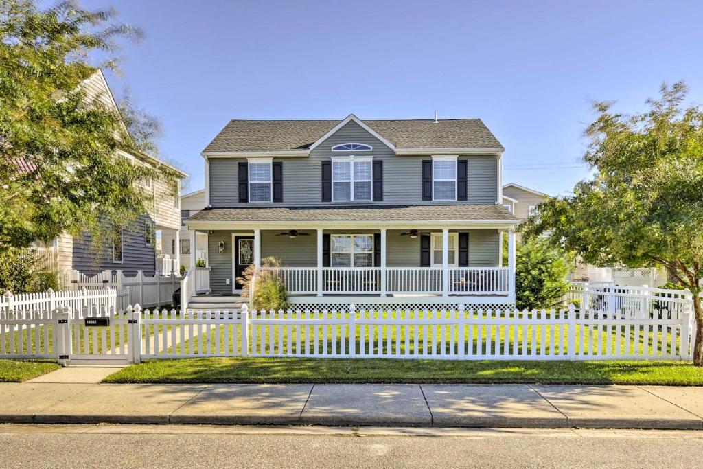 a house with a white picket fence at Breezy Ocean City Home Walk to Beach and Boardwalk! in Ocean City