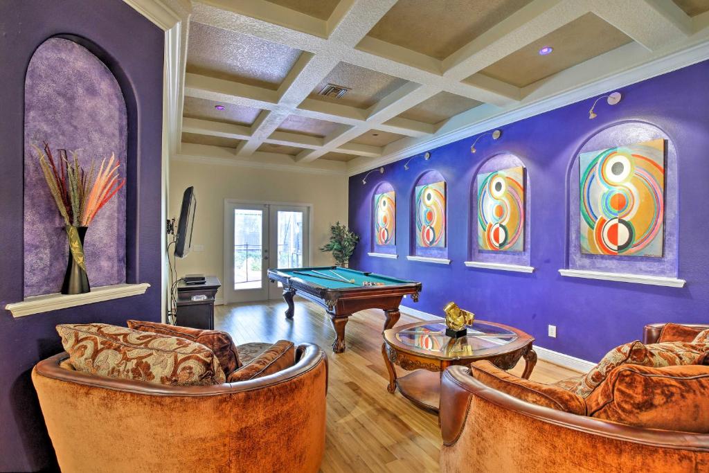 a living room with couches and a pool table at Contemporary Brandon Home with Pool and Game Room in Brandon