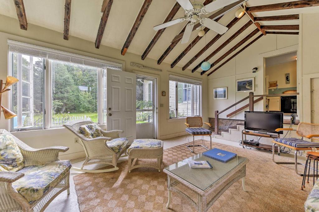 a living room filled with furniture and a flat screen tv at Mattapoisett Home on 7 Acres with Private Beach! in Mattapoisett