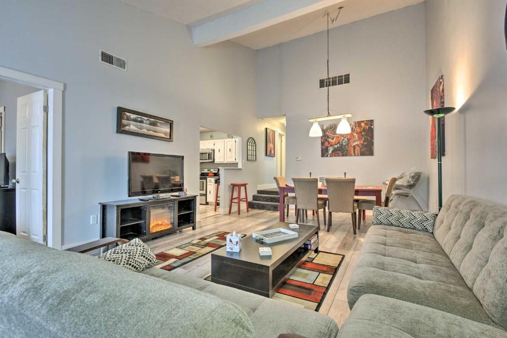 a living room with a couch and a table at Mount Pocono Condo with Balcony - Near Mt Airy Casino in Mount Pocono