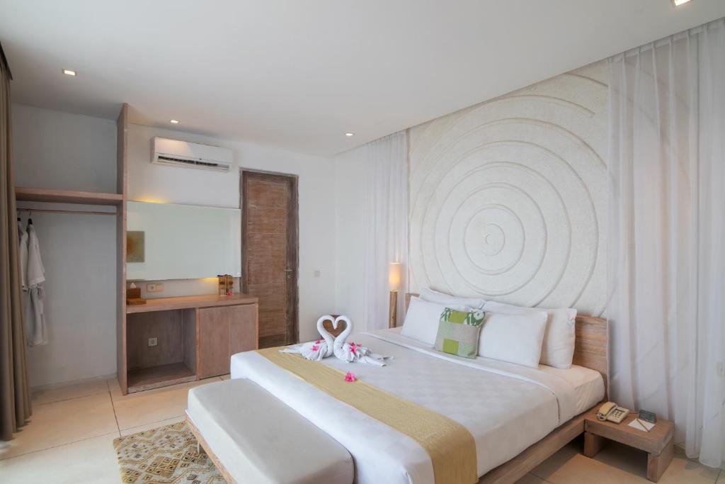Postel nebo postele na pokoji v ubytování Svarga Resort Lombok