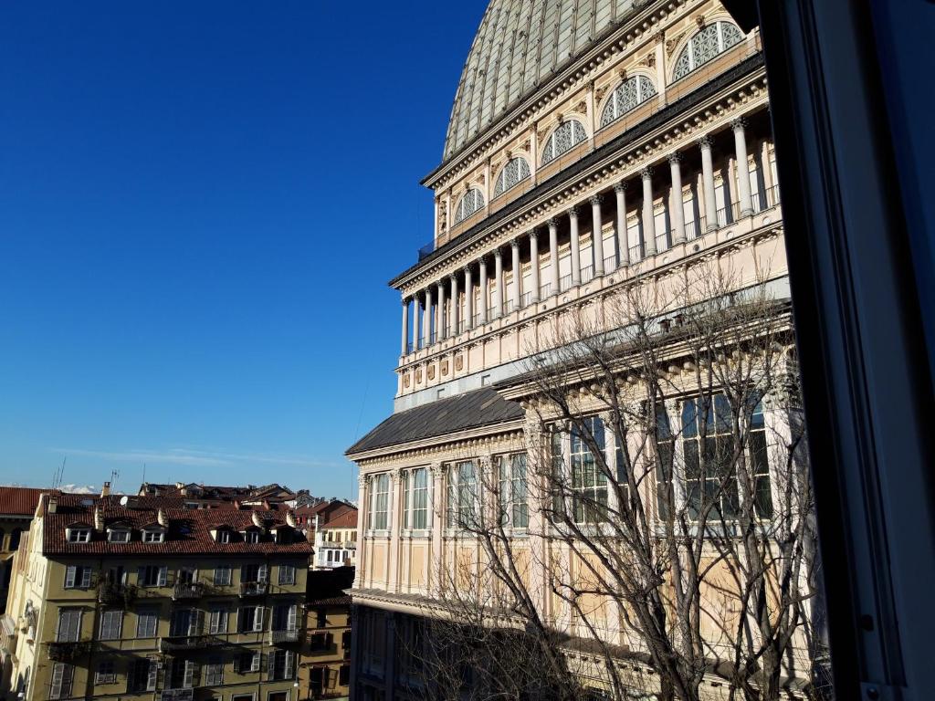 a view of a large building in a city at La Mole apartment in Turin