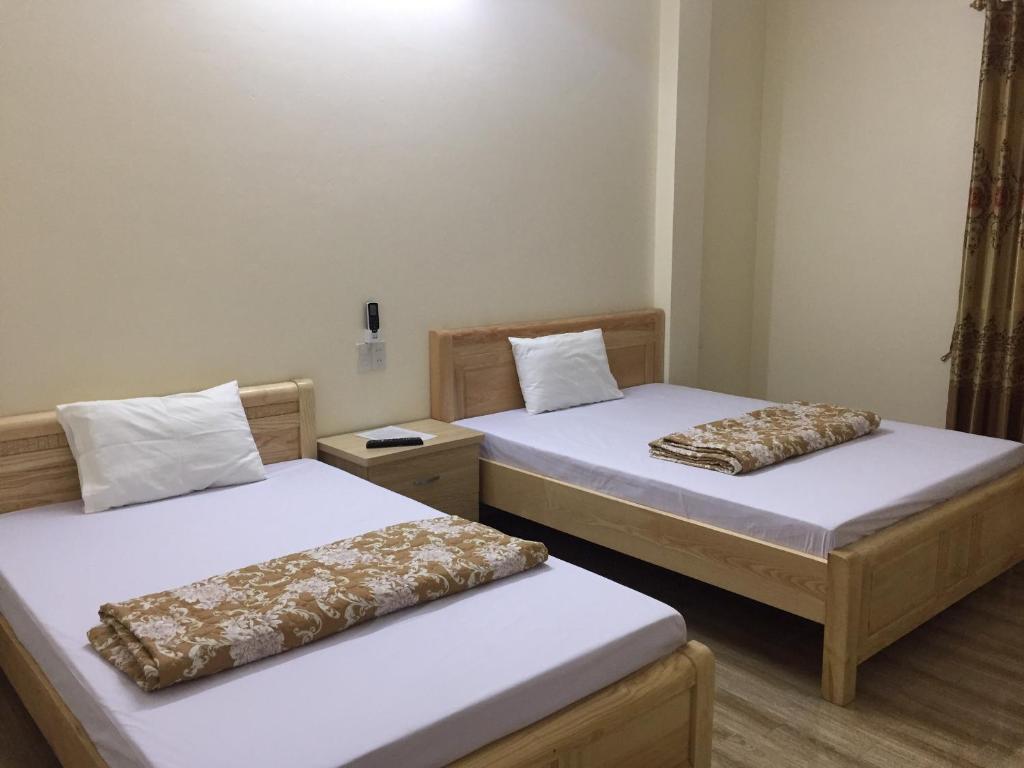 Postel nebo postele na pokoji v ubytování Việt Dũng Motel