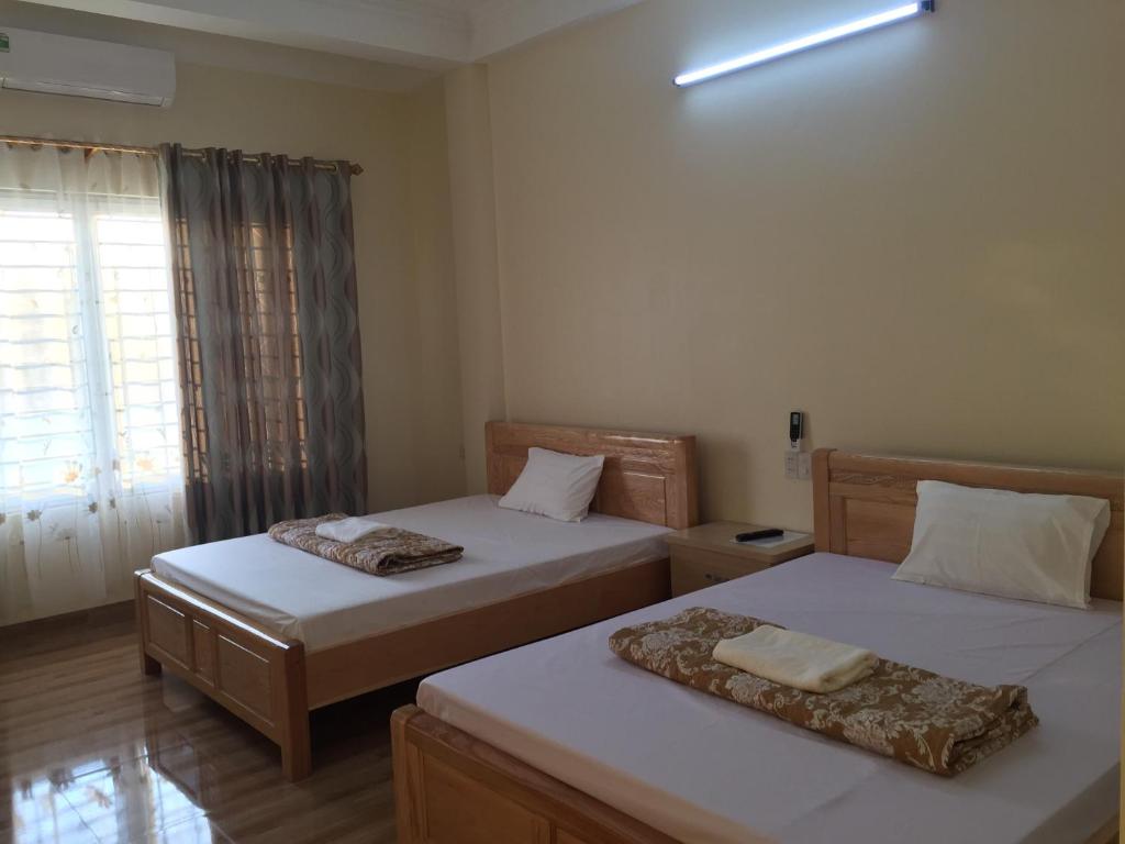 Postel nebo postele na pokoji v ubytování Việt Dũng Motel