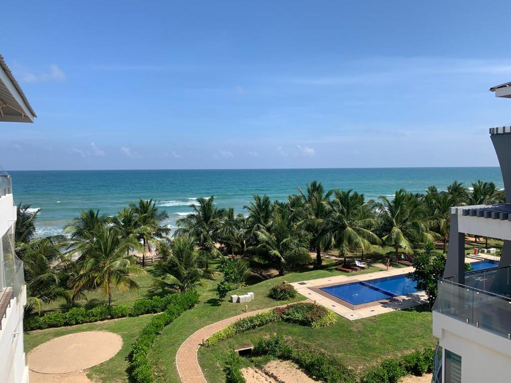 an aerial view of the ocean from a building at Araliya OceanFront Condos Nilaveli, Trincomalee in Nilaveli