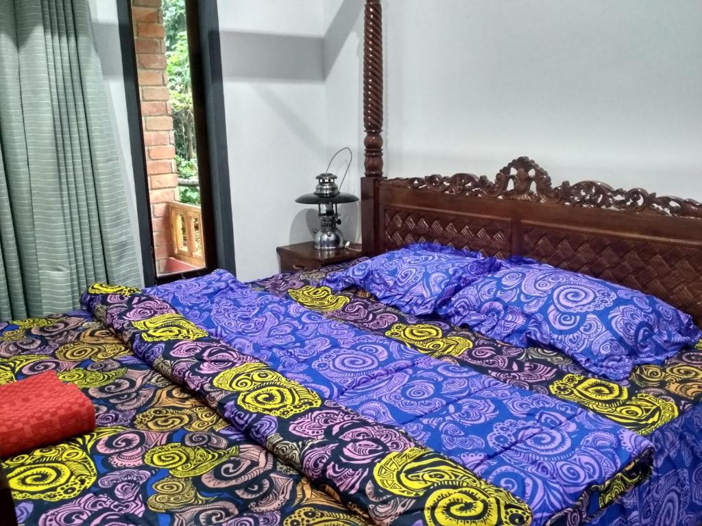 Postel nebo postele na pokoji v ubytování KOPIKUIN bromo homestay