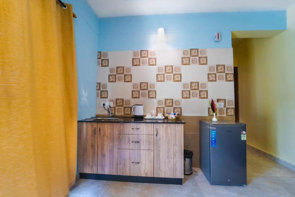 Kuchyň nebo kuchyňský kout v ubytování Mariners Bay Suites