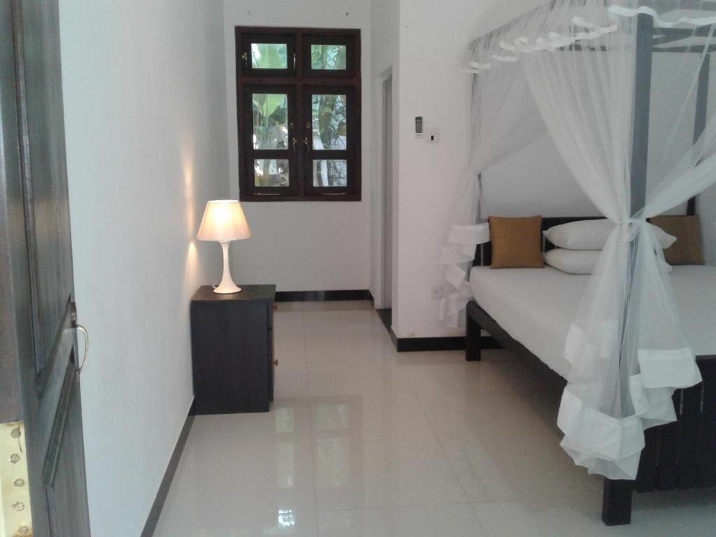 Postel nebo postele na pokoji v ubytování Apna Homestay Apartments