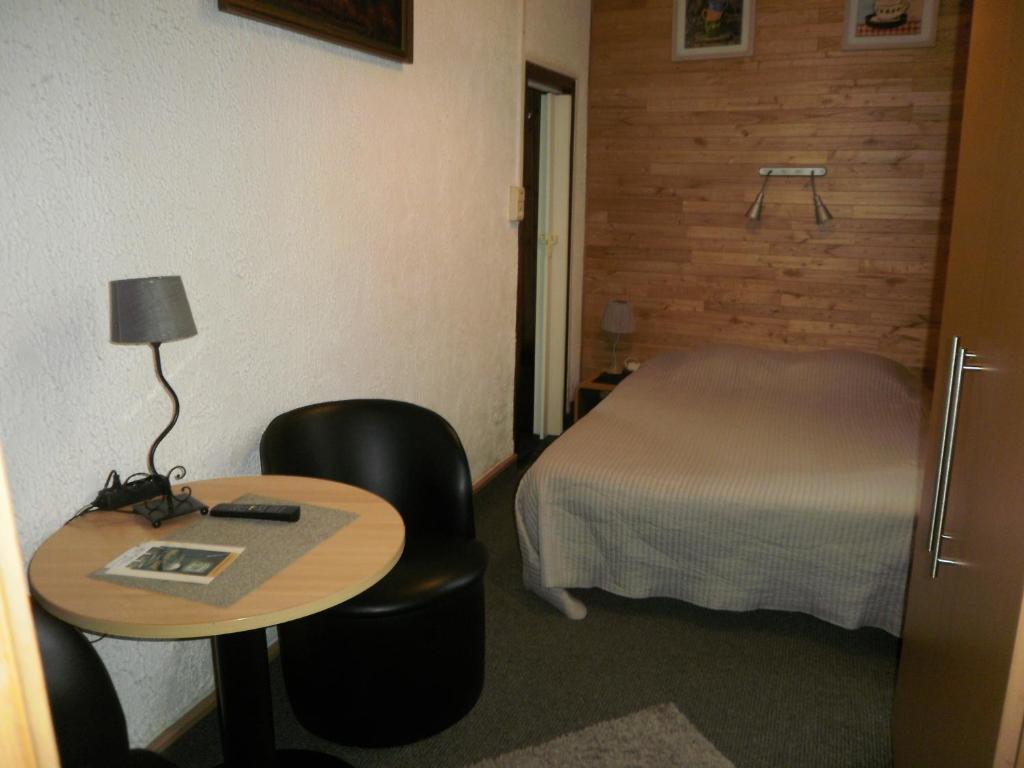 Postel nebo postele na pokoji v ubytování Le Liège