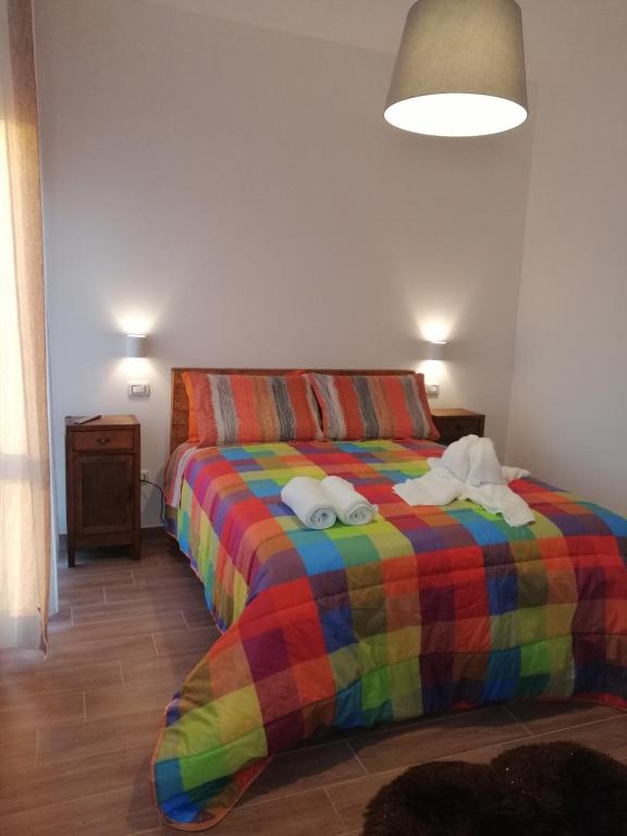 A bed or beds in a room at B&B Belli Dentro