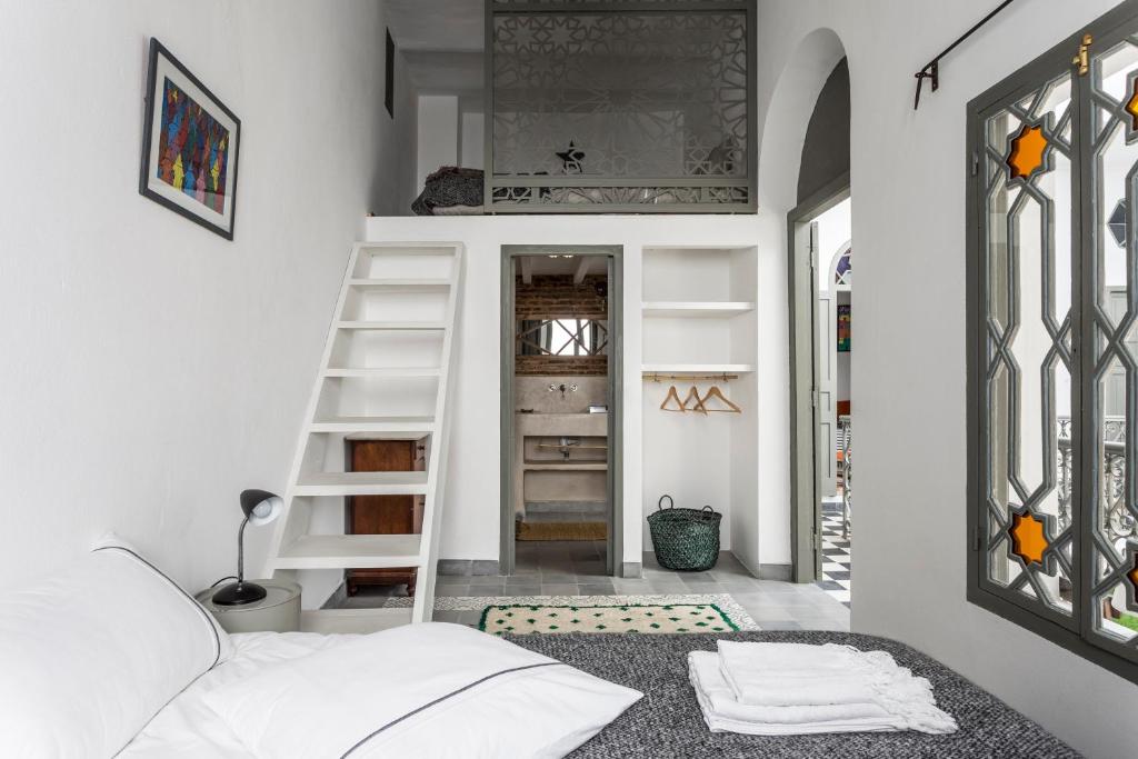 Postel nebo postele na pokoji v ubytování Riad Dar-tus