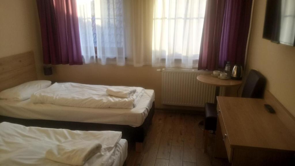 Postel nebo postele na pokoji v ubytování Magnolia- Pokoje Gościnne