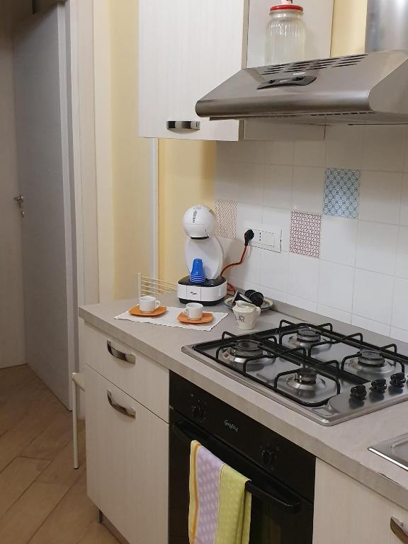 A kitchen or kitchenette at Al Blu Ortigia Apartments