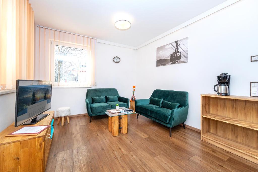 Telewizja i/lub zestaw kina domowego w obiekcie Appartement Living Schönwies including Zell am See-Kaprun summercard