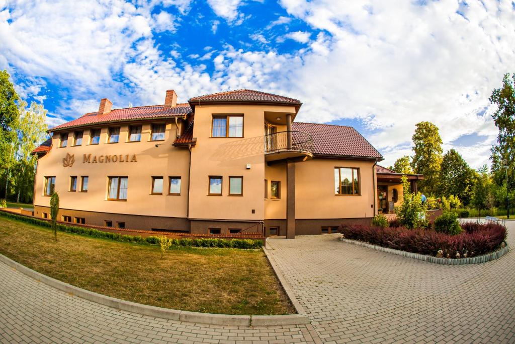 a large building with a yard in front of it at Magnolia- Pokoje Gościnne in Zgorzelec