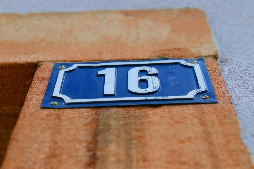 a blue and white sign with the number on it at BLEU Seize in Natzwiller