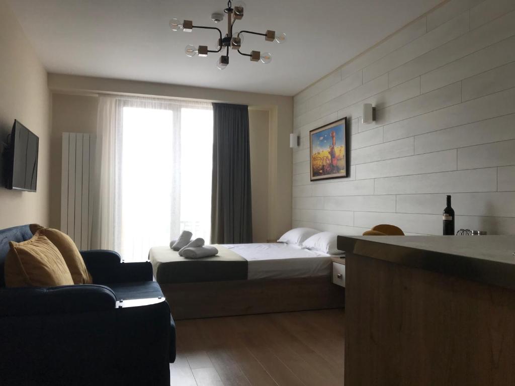 TV a/nebo společenská místnost v ubytování New Gudauri, Red Co, Loft 1
